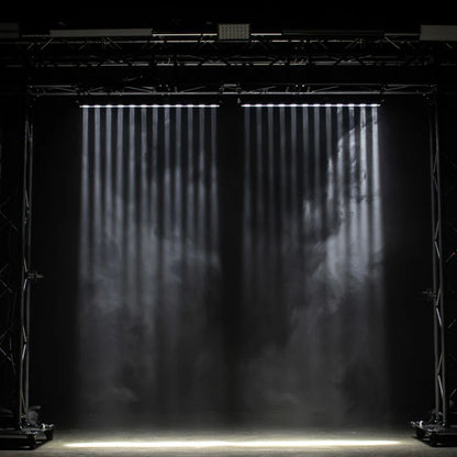 Hanging ADJ Ultra Beam Bar 12CW LED Bar beaming white lights downward in dim venue