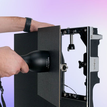 ADJ VSMRT Magnetic Module Removal Tool being used to remove LED panel on purple background