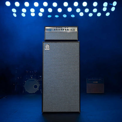 Front view of Ampeg HSVT-810AV Heritage 8x10" 800W Bass Cabinet with Ampeg Amp Head on top on stage