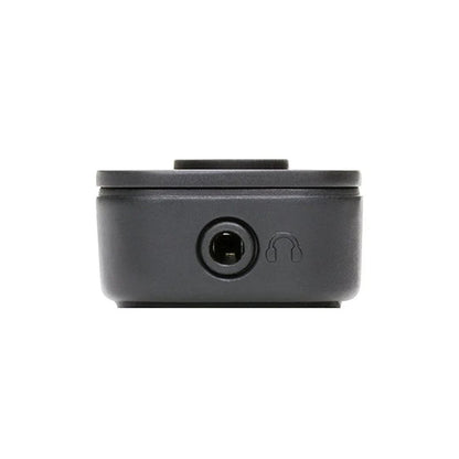 Black electronic component with headphone jack on a white background