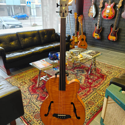 Hanging view of Aria FEB F2/FL Fretless Bass Stained Brown in music store