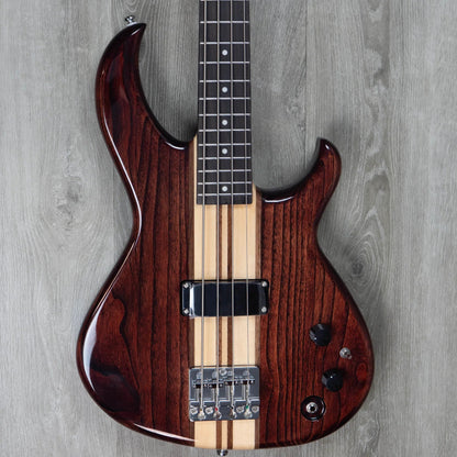 Close up front view of Aria Pro II SB 700 Electric Bass Guitar Walnut on grey wood floor