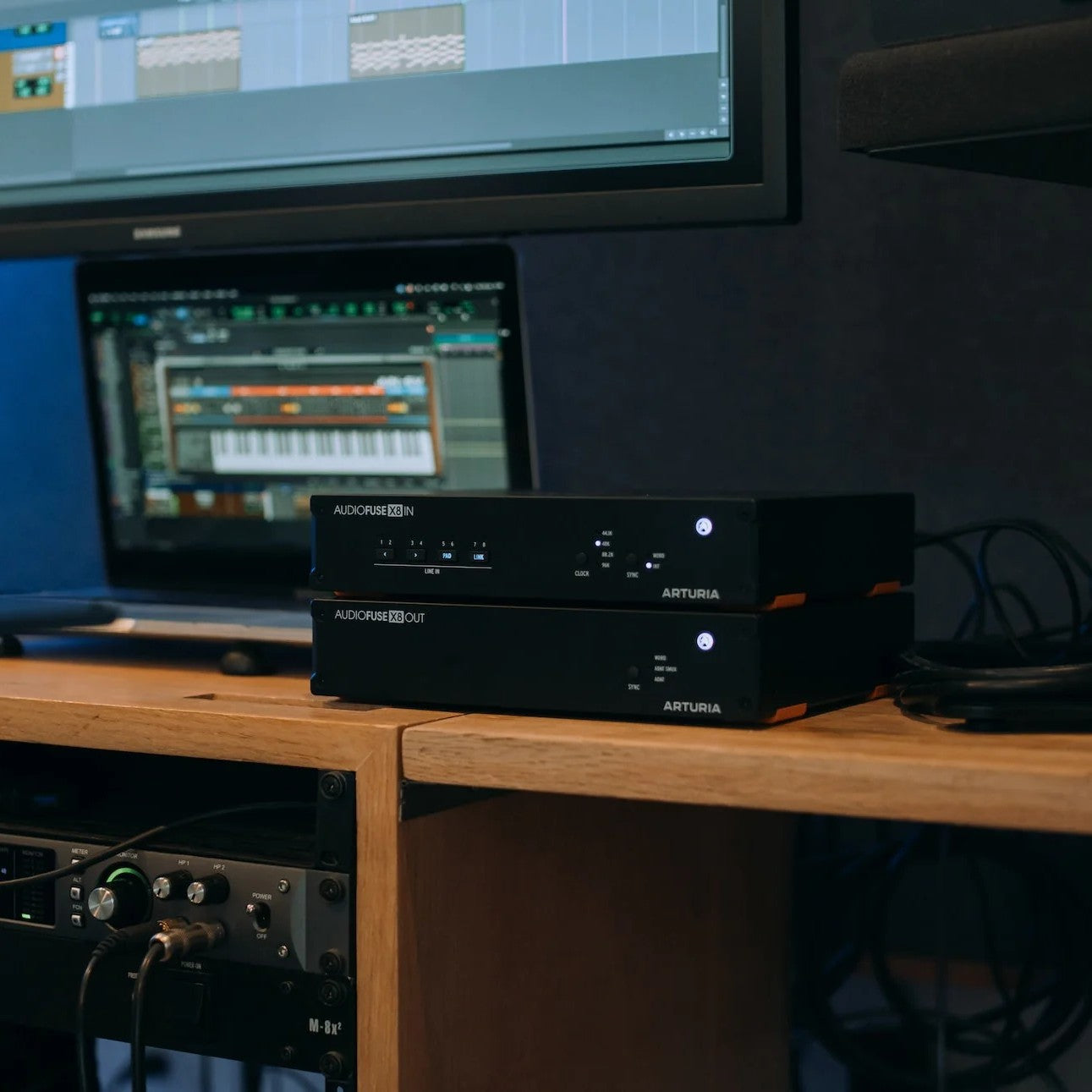 Angled view of Arturia AudioFuse X8 IN and OUT ADAT Expanders on desk in studio
