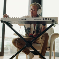 Musician playing the Arturia KeyLab 49 mk3 MIDI Controller White in studio