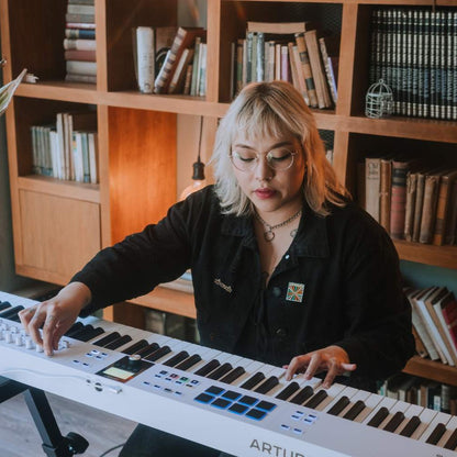 Pianist playing with of Arturia KeyLab 88 mk3 MIDI Controller White in home studio