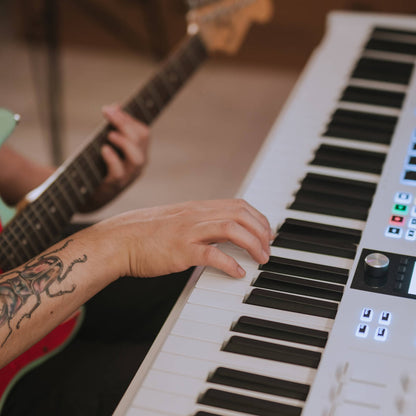 Close up of musician playing with Arturia KeyLab Essential 88 mk3 MIDI Controller White in studio
