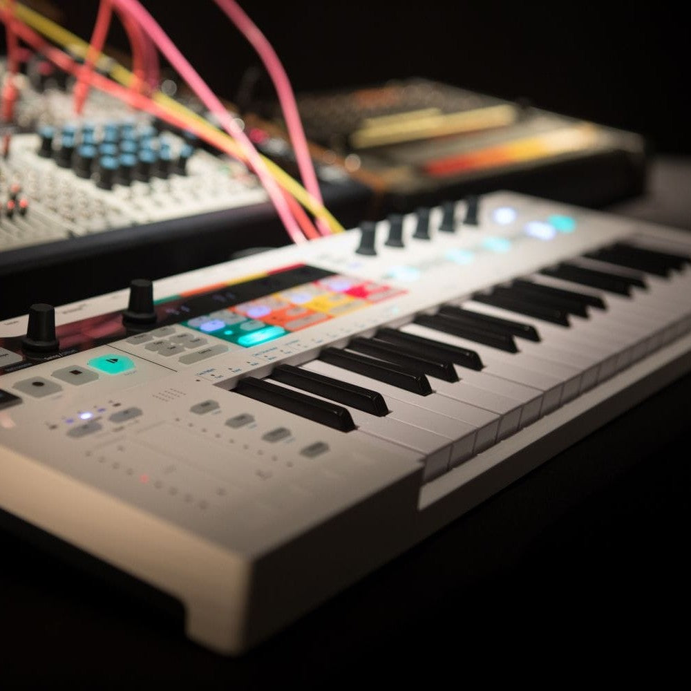 Angled close up view of Arturia KeyStep Pro MIDI Controller & Sequencer White in studio