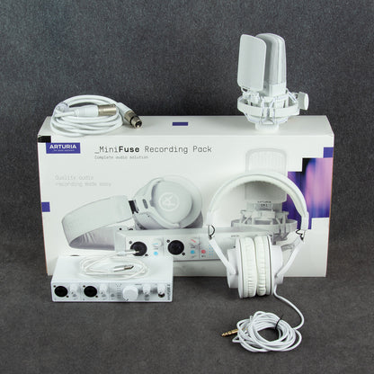 Inclusions of Arturia MiniFuse Recording Pack White on top of box on gray surface