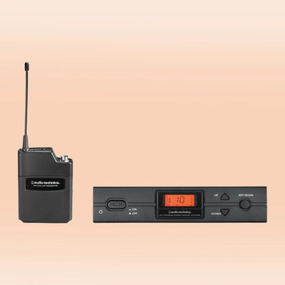 Inclusions of Audio-Technica ATW-2110c 2000 Series Wireless Body-pack System on orange background