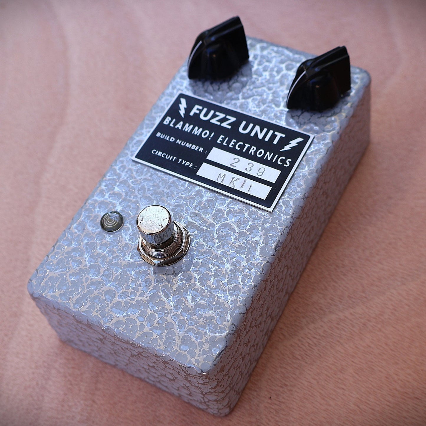 Angled view of BLAMMO! Electronics P2P Tone Bender MKii Pedal on wooden surface