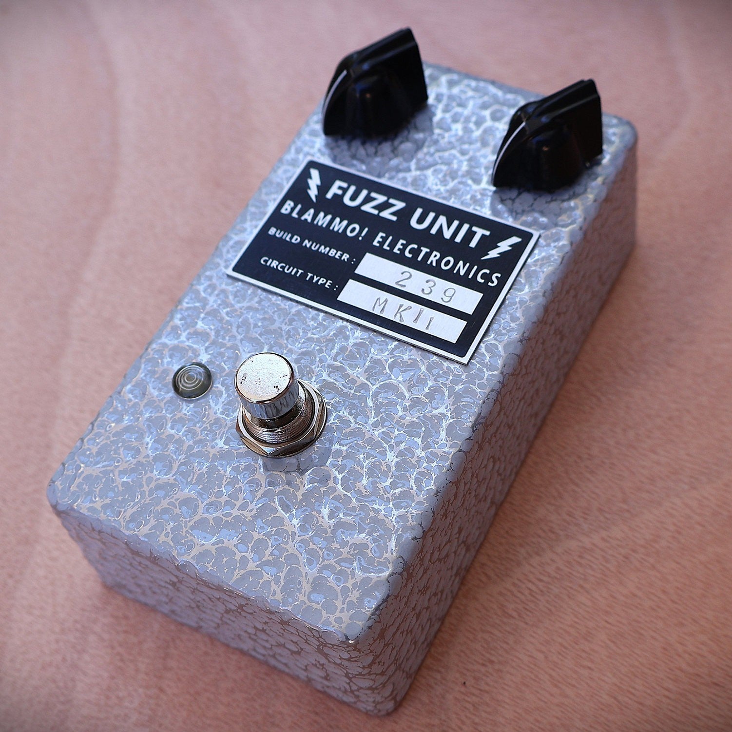 Angled view of BLAMMO! Electronics P2P Tone Bender MKii Pedal on wooden surface