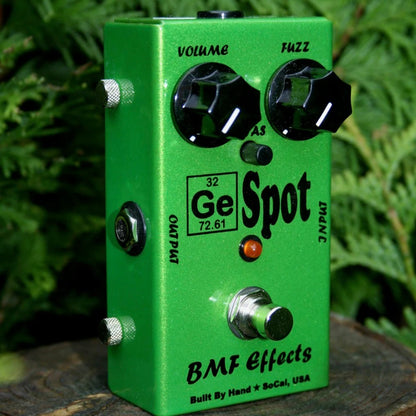 Angled view of BMF Effects Ge Spot Germanium Fuzz Pedal with leaves in background