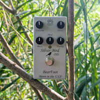 Front view of BearFoot FX Silver Bird Pedal on a tree branch with trees and leaves as background