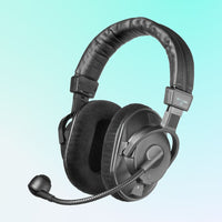 Black over-ear headphones with a microphone on a light blue background