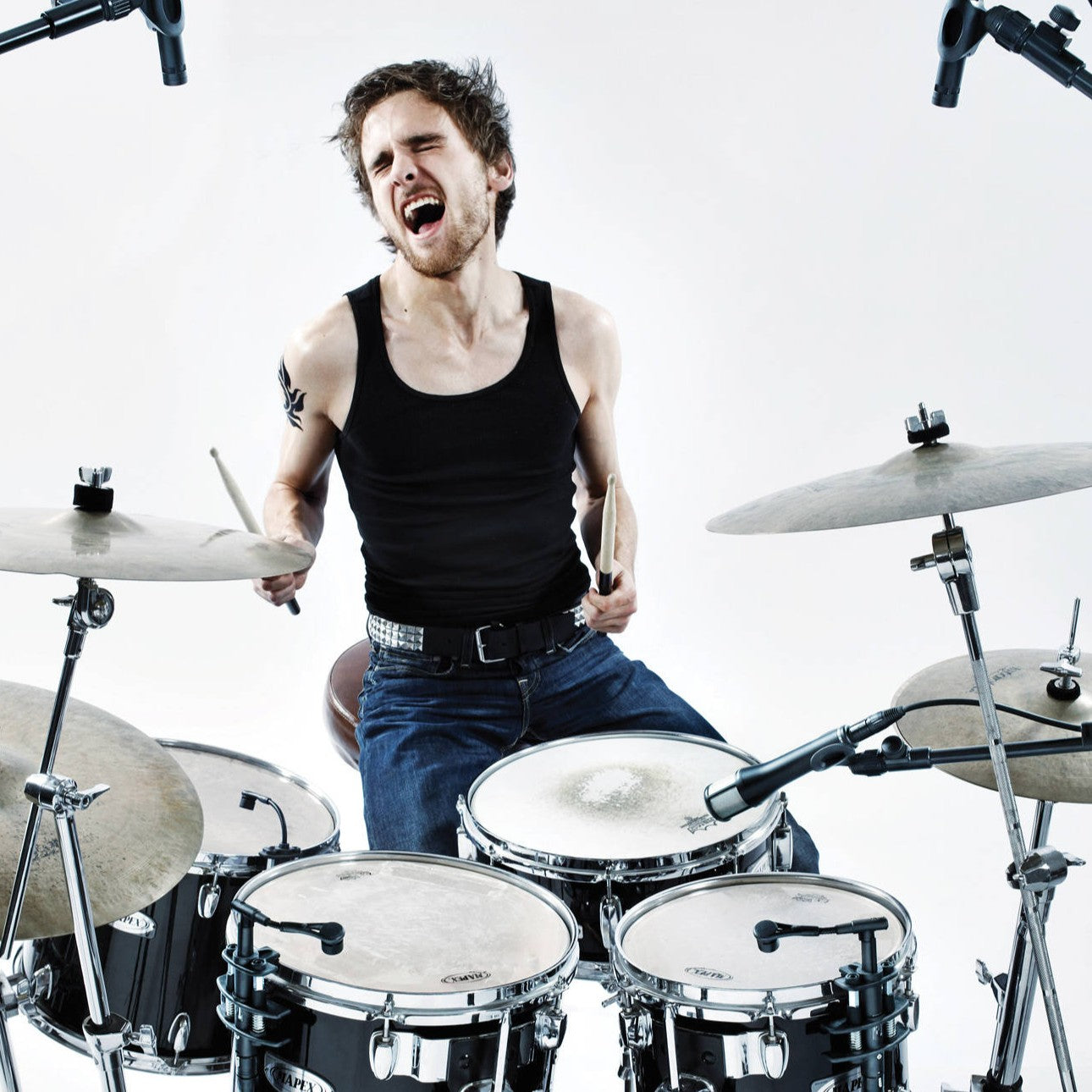 Beyerdynamic TG D57 Condenser Drum Microphone mounted on drums with drummer playing in studio