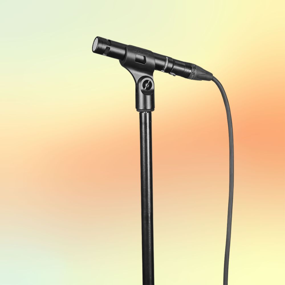 Beyerdynamic TG I53 Condenser Instrument Microphone on a mic stand on yellow and orange background