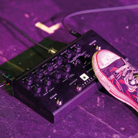 Blackstar AMPED 3 100W Guitar Amplifier Pedal on floor with cables attached and with shoe stepping on it