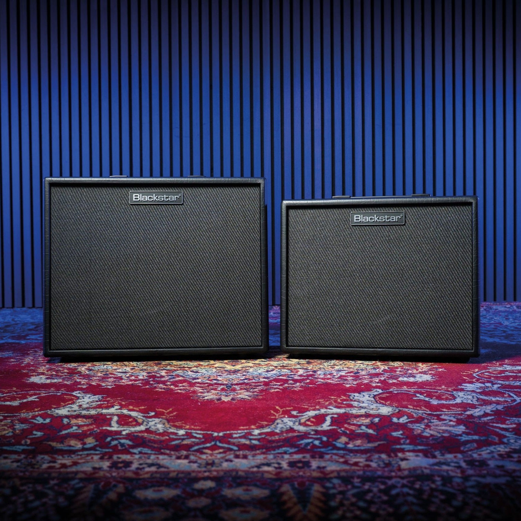 Side by side front view of Blackstar Artist FR Cabinet Special and Standard on paisley rug in studio