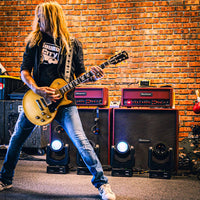 Doug Aldrich performing with two Blackstar DA412B Doug Aldrich Signature Cabinets behind him in venue