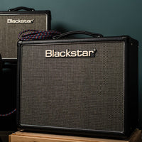 Front view of Blackstar HT-5R MK III Combo Amplifier on wooden crate with another Blackstar amplifier in the background