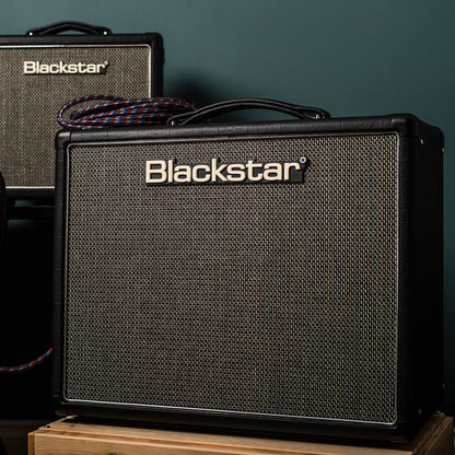 Front view of Blackstar HT-5R MK III Combo Amplifier on wooden crate with another Blackstar amplifier in the background