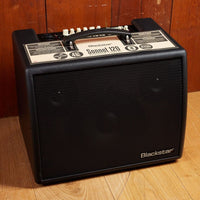 Angled front view of Blackstar Sonnet 120 Acoustic Guitar Amplifier Black on wooden floor with wooden wall