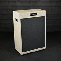 Angled front view of Blackstar St. James 212VOC Cabinet Fawn with grey brick wall background