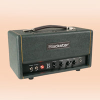 Angled front view of Blackstar TV-10 BH Guitar Amp Head on orange background