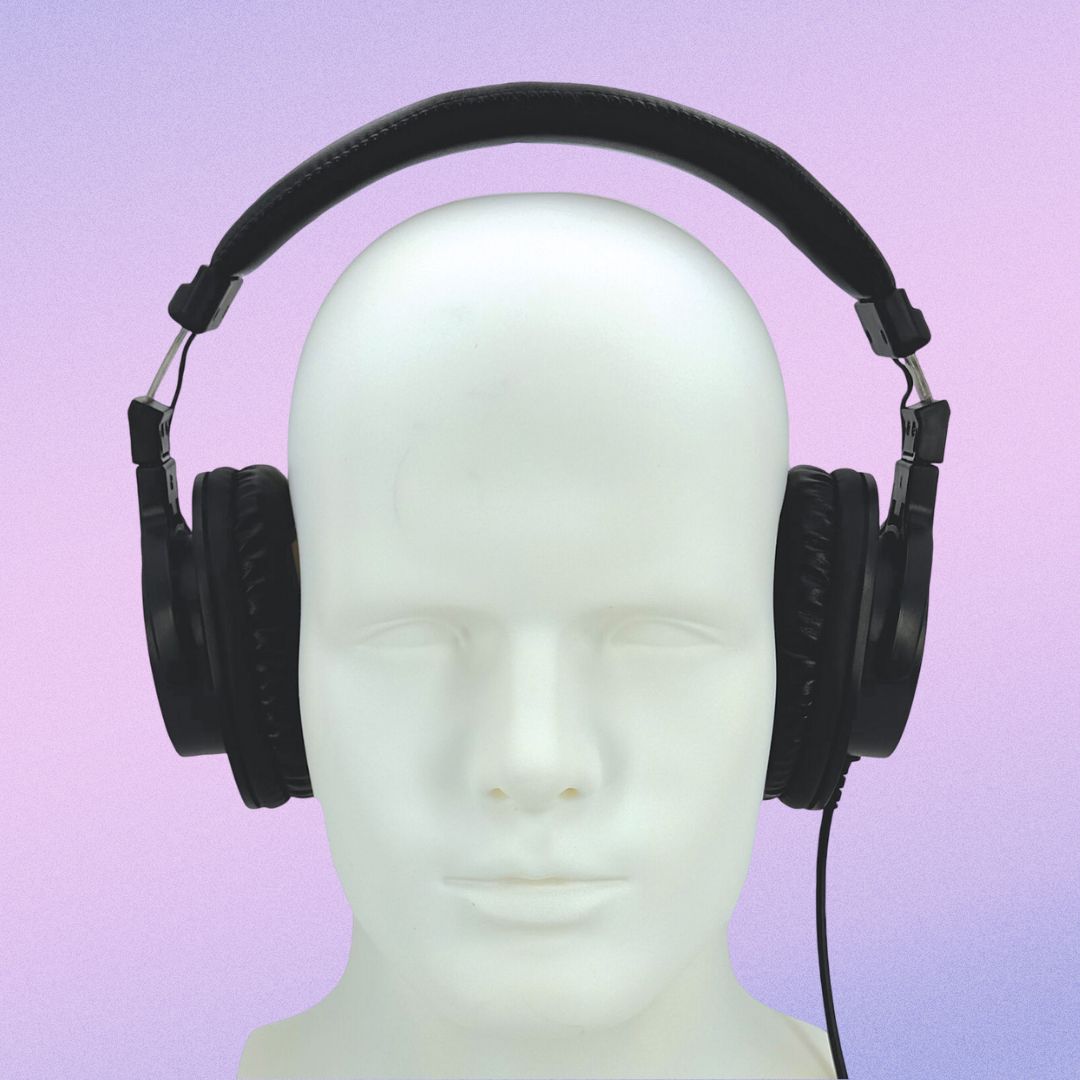Front view of CAD Audio MH500 Closed-Back Over-Ear Headphones on mannequin head on purple background