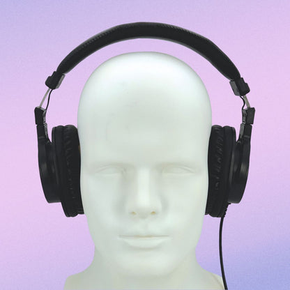 Front view of CAD Audio MH500 Closed-Back Over-Ear Headphones on mannequin head on purple background