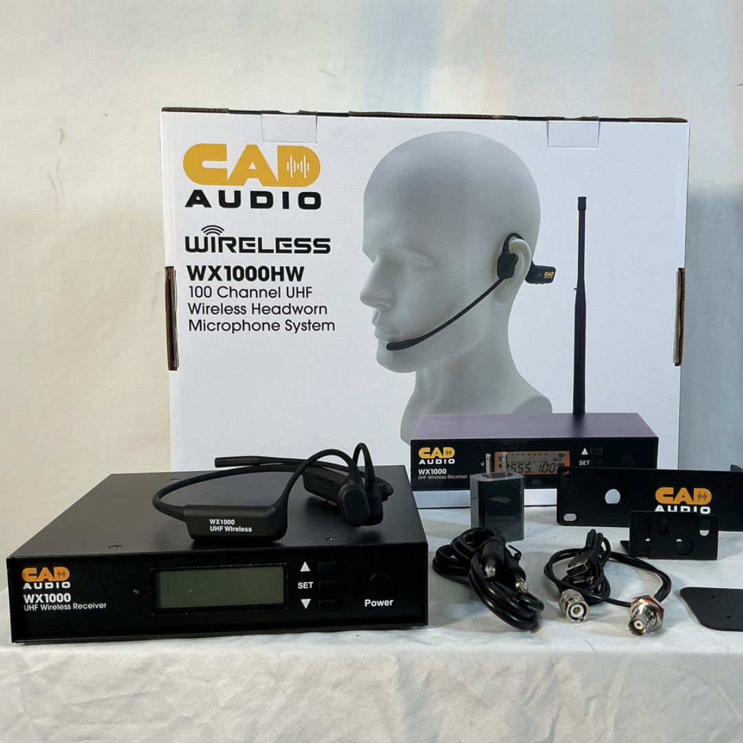 CAD Audio WX1000 Wireless Microphone System Headworn Microphone with all its inclusions and box on top of table
