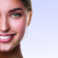 Front view of CAD Audio WX19 Earworn Microphone on female head on purple background