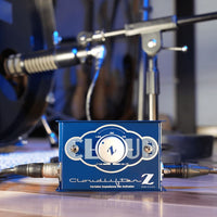 Blue Cloudlifter Z audio device on a reflective surface with blurred background