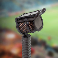 Cloes up angled view of Coles 4104B with a sports stadium background