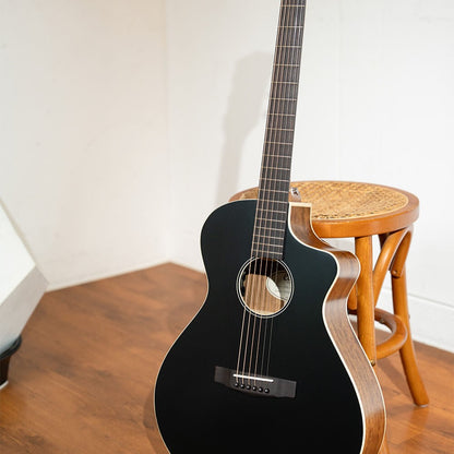 Close up view of Cort Core-MC Ovangkol Acoustic Electric Guitar (Black Top Semi Gloss) leaning on stool in room