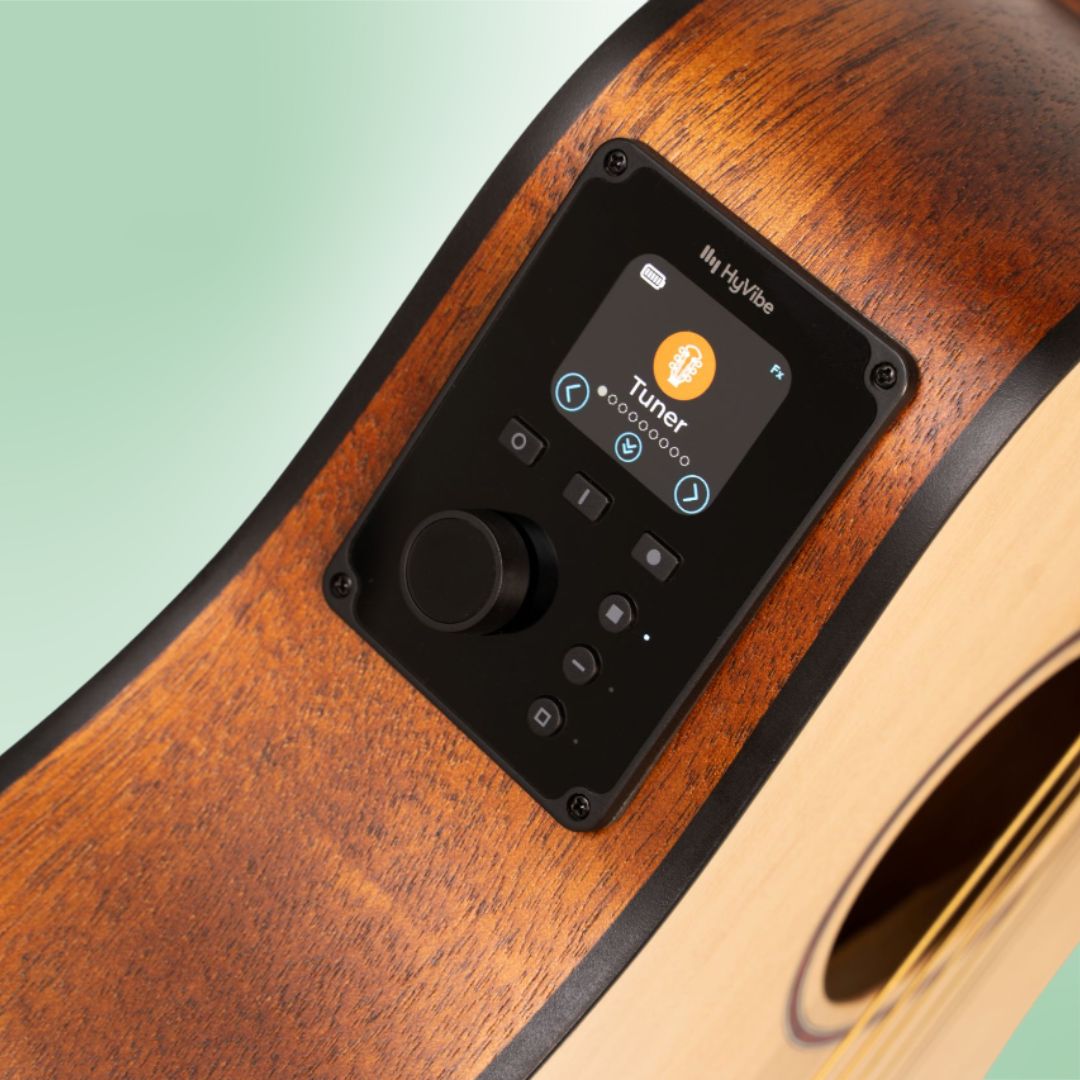 Close up view of Cort Earth GO HyVibe Open Pore Natural Pickup on green background