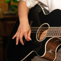 Close up view of Cort Exotic-SFX Ash Acoustic Electric Guitar being played in living room