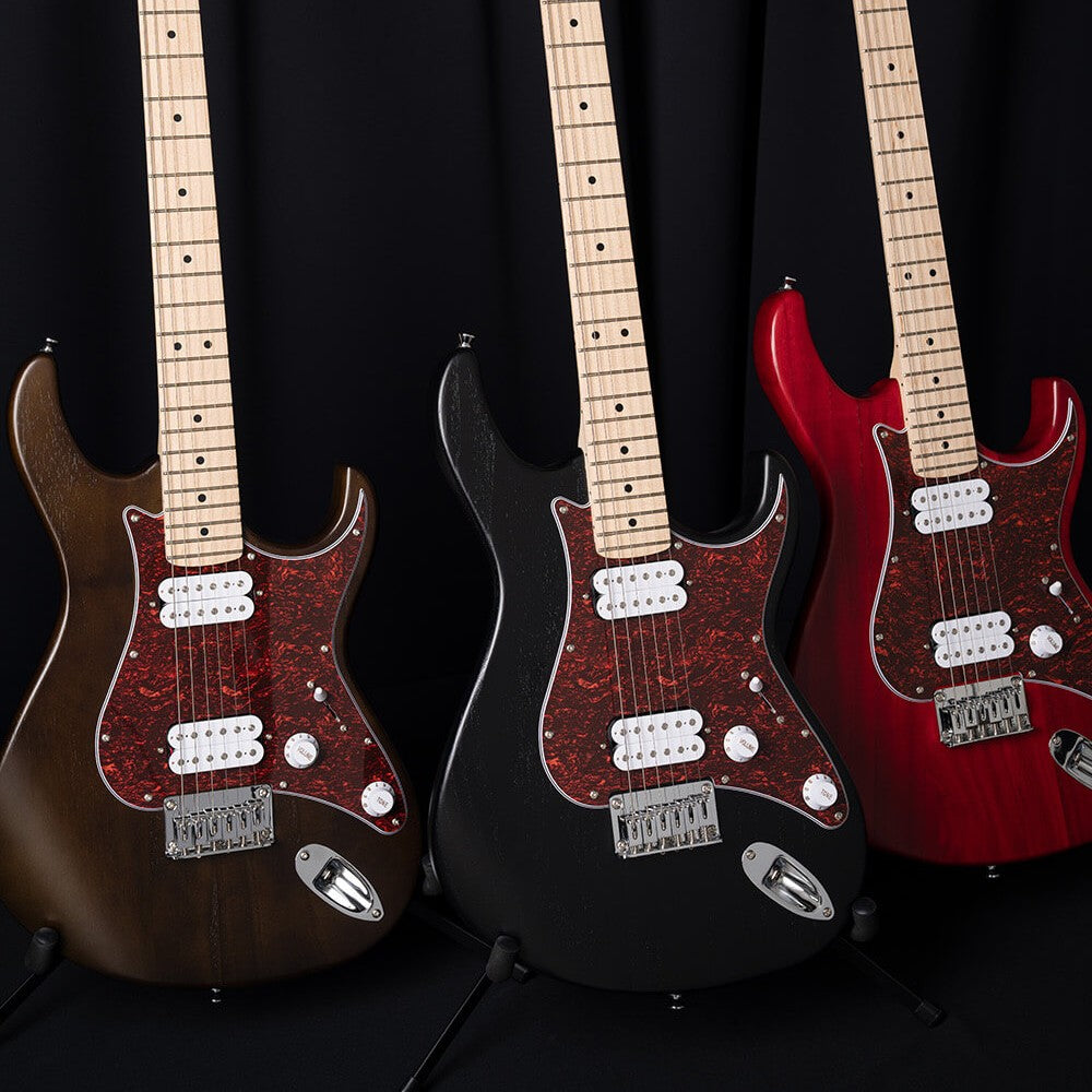 Side by side view of Cort G100 HH Electric Guitar Open Pore Walnut, Open Pore Black Cherry, and Open Pore Black 