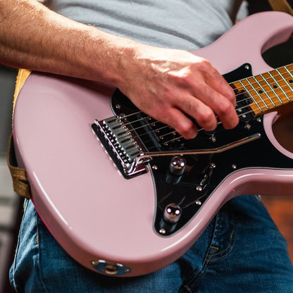Close up view of guitarist playing the Cort G290 Modern Electric Guitar Dusty Rose