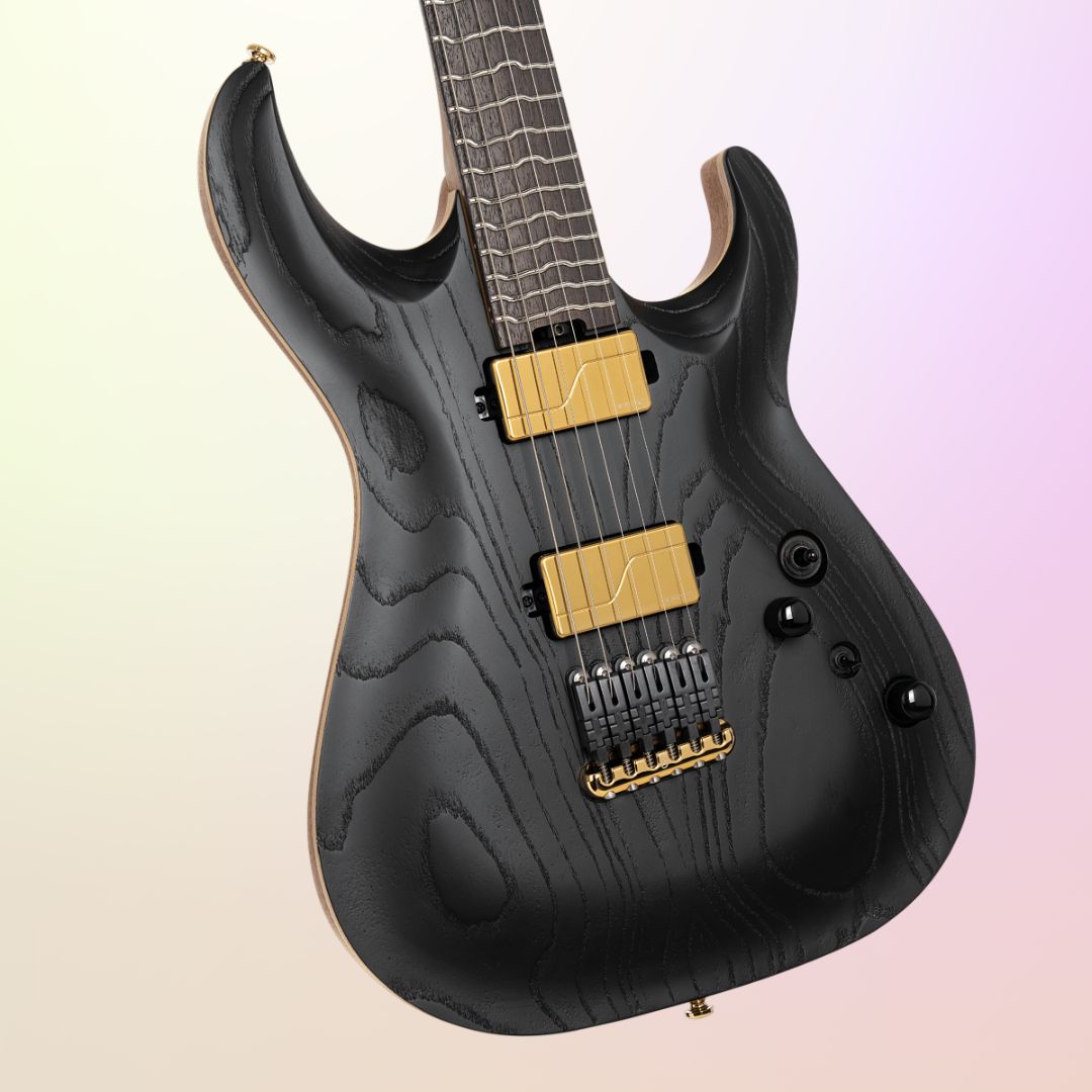 Close up front view of Cort KX700TT-G Limited Edition Electric Guitar on yellow and pink gradient background