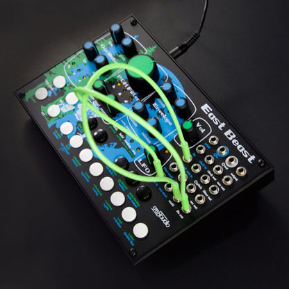 Electronic music synthesizer with green cables on a black background