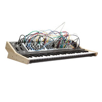 Synthesizer with visible wiring on a white background