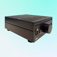 Angled front view of DACS Audio Purity Headphone Amplifier on blue background