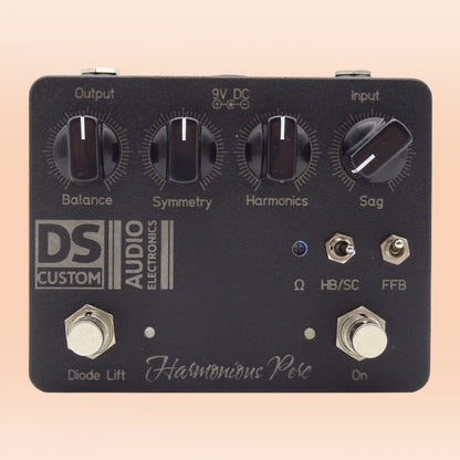 Front view of DS Custom Harmonious Perc Pedal on orange background