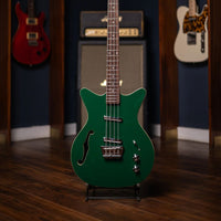 Close up front view of Danelectro Fifty Niner Short Scale Bass Guitar (Jade) with studio background