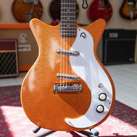 Close up front view of Danelectro '59M NOS+ Electric Guitar Orange Metal Flake in studio
