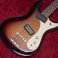 Close up view of Danelectro '64 Bass Guitar 3-Tone Sunburst on red carpet