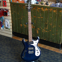 Front view of Danelectro '66T Electric Guitar Transparent Blue in music shop