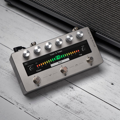 Angled view of Darkglass Anagram Pedal on grey wooden surface