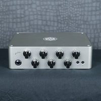 Angled front view of Darkglass Exponent 500 Bass Amplifier Head on grey surface